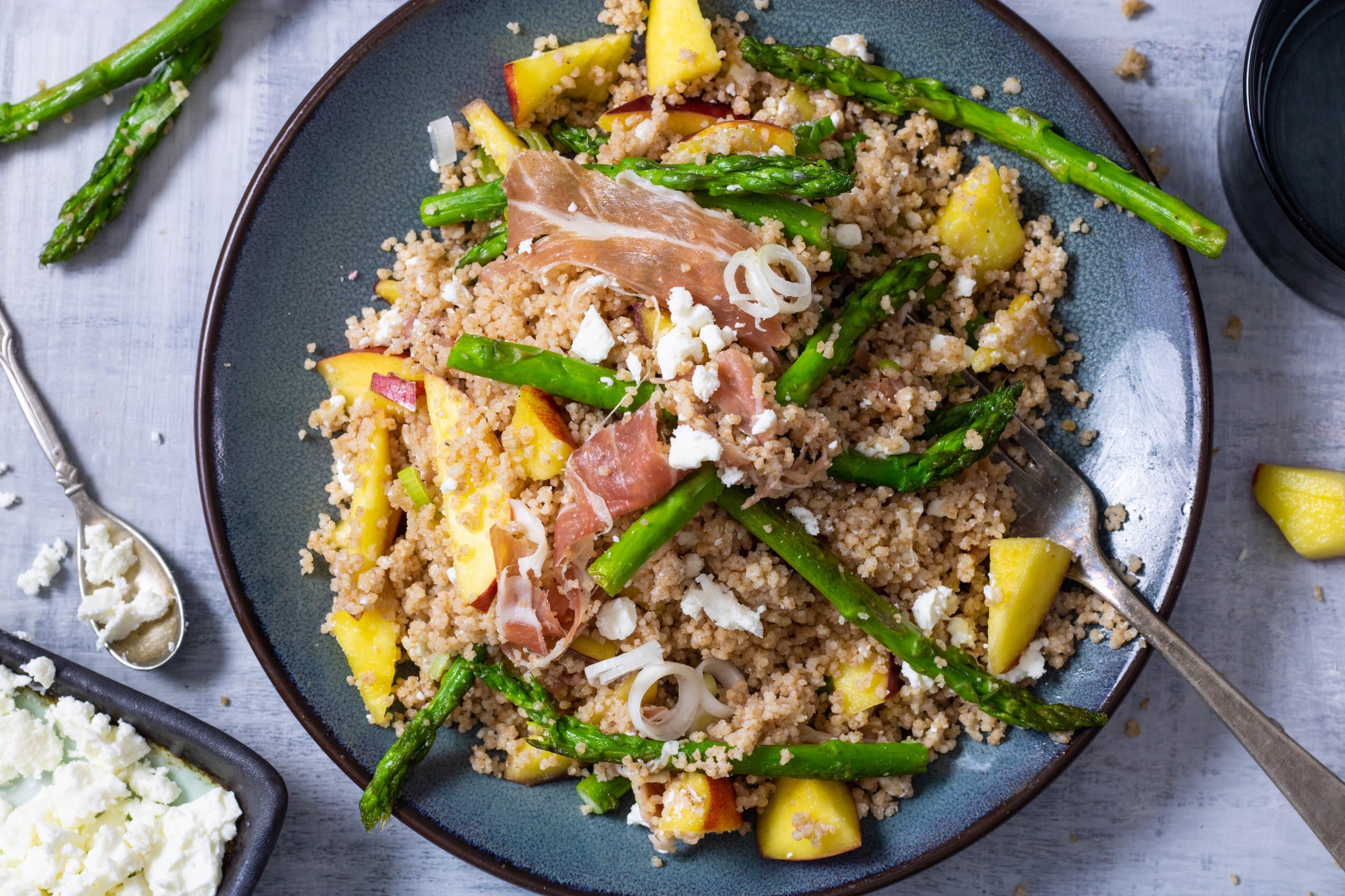 Couscous met nectarine en parmaham